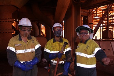 Mitchell Walsh, Shannon Weston and Forrest Personnel Supervisor, Michael English under the bauxite grinding mills Mitchell Walsh, Shannon Weston and Forrest Personnel Supervisor, Michael English under the bauxite grinding mills